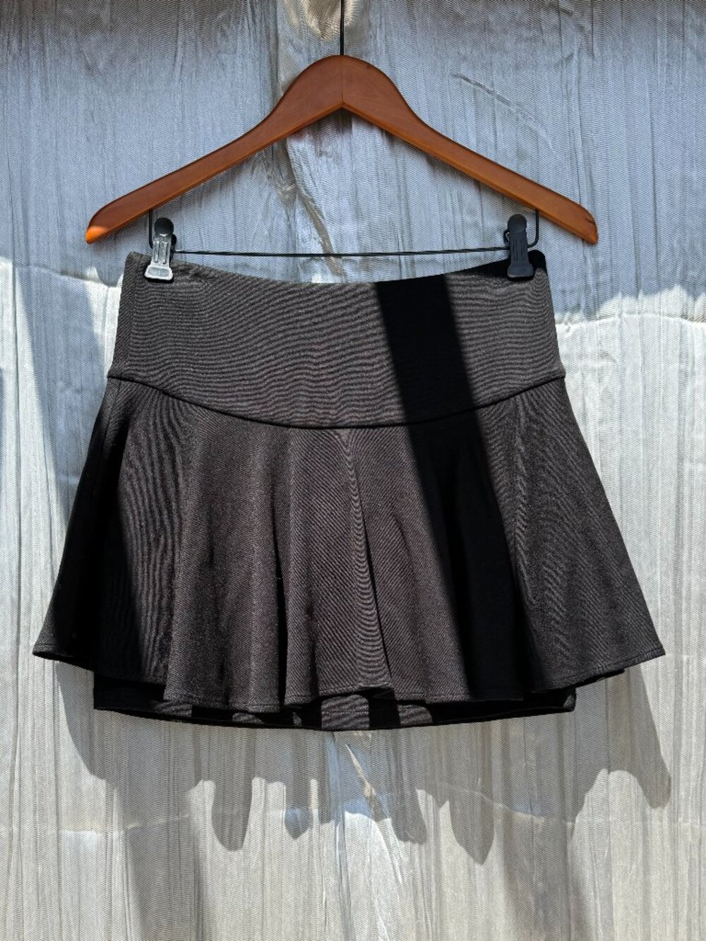 LaRok black thick flare skirt with tight skirt underneath for coverage.